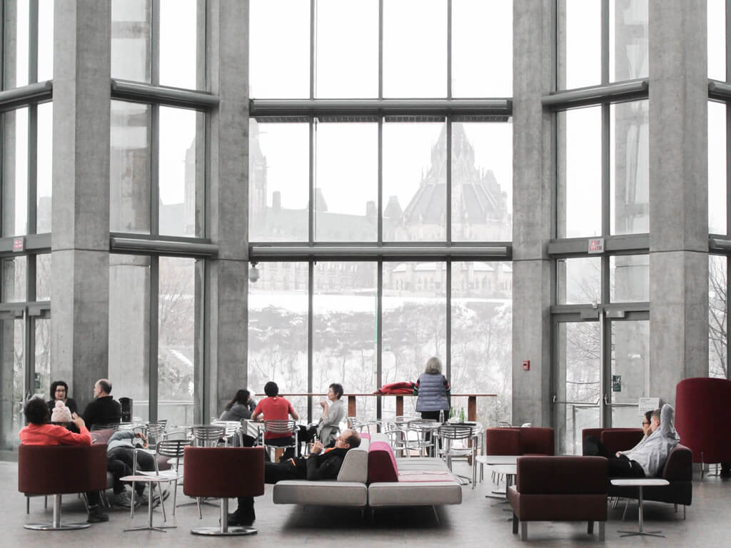 Bright open-plan lounge with tall windows