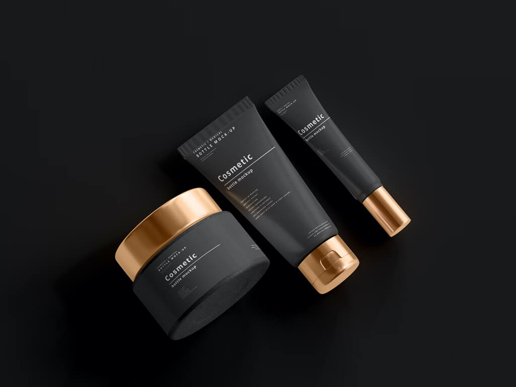 Dark cosmetic jars and tubes with gold caps